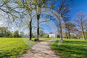 Foot path in a beautiful landscaped park Jenischpark in Hamburg, Germany