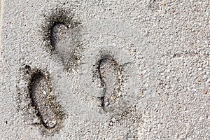 Foot print on grunge concrete texture