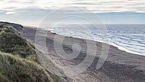 Foot prints dotted over the beach at Formby