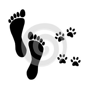 Foot prints man and dog walking 