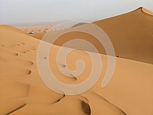 Foot prints on Sahara desert dunes in Marocco