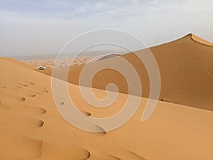 Foot prints on Sahara desert dunes in Marocco