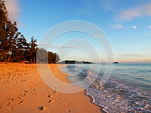 Foot prints in the sand along Waimanalo Beach at Dawn photo