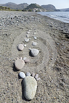 Foot prints of stones on beach Lesvos