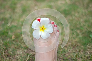 Foot with red nails