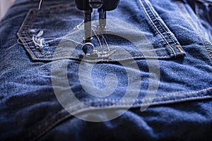 Foot of Sewing Machine on Jeans