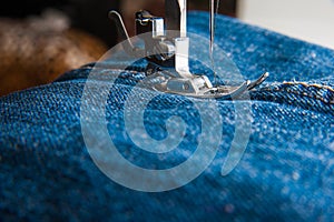 Foot of Sewing Machine on Jeans