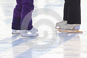 Foot skating girls and women on an ice rink