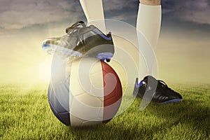 Foot with soccer ball ready to play