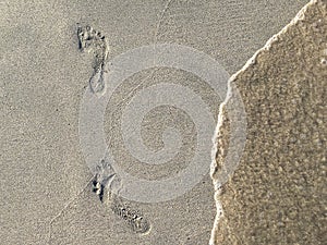 Foot Steps Prints On Ocean Beach