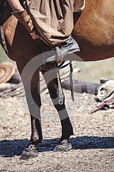 Foot in the stirrup horse rider
