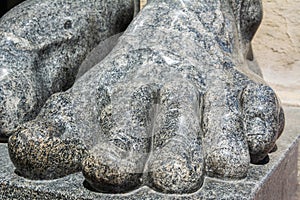 Foot and toes on the foot of granite atlantes holding up the portico of the New Hermitage building in Saint Petersburg, Russia