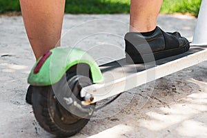 Foot of woman on electric scooter