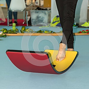 Foot on Yellow Curved Board Concept: Flyboard