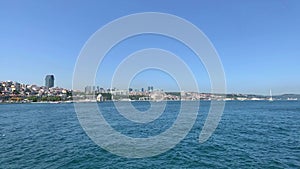 Footage of Bosphorus strait, cityscape of European side and bridge in Istanbul. It is a sunny summer day. Beautiful scene.