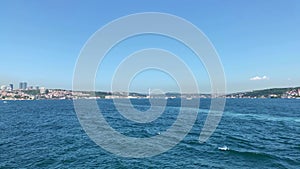 Footage of Bosphorus strait, cityscape of European side and bridge in Istanbul. It is a sunny summer day. Beautiful scene.