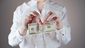 Footage of businesswoman in white shirt with dollar in hands