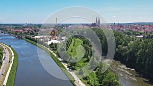 Footage of the city of Regensburg in Bavaria with a view of the Dult folk festival and cathedral, Germany