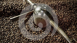 Footage from coffee roaster, fresh roasted coffee beans
