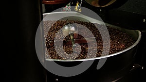 Footage from coffee roaster, fresh roasted coffee beans