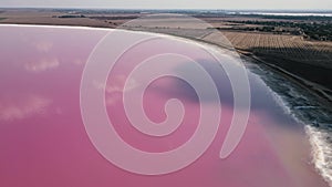 footage of a drone flying over a pink lake. amazing aerial landscape nature beauty