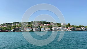 Footage of Istinye / Yenikoy area of Istanbul by Bosphorus strait. Beautiful scene. It is a sunny summer day.