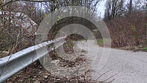 Footage of a man with backpack riding a bicycle in the forest