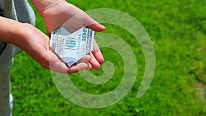 Footage of money hand grass background