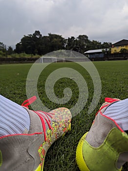 Footbal shoes on a green grass field