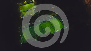 Footbal soccer field night aerial. Clip. Birds eye view of a soccer football court. Top view of the football field at photo