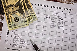 Football American office pool grid sports betting concept, flat lay