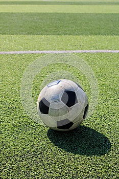 Football on artificial turf. It is for green background in a stadium