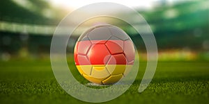 Football ball with flag of Germany on the field of football stadium and space for name of football clubs. Football championship of