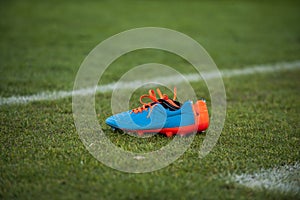 Football boots on field