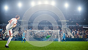 Football Championship: White Team Forward Hits the Ball and Scores Perfect Goal. Goalkeeper Jumps