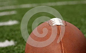 Football close up with yard lines