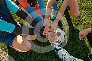 Football coach motivating junior football team before match