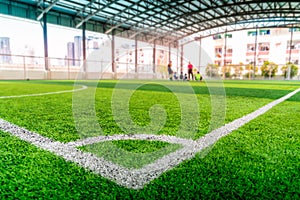 Football Corner line on green artifact grass of soccer indoor pitch