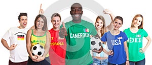 Football fan from Cameroon showing thumb with ball and other fans