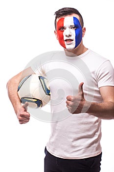 Football fan of France national team with ball in arm show okey sign