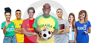 Football fan from Ghana with soccer ball supporters from Spain Brazil Mexico Qatar Argentina and France