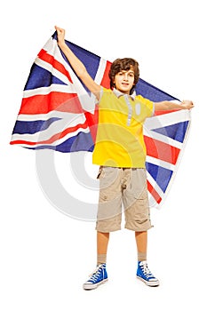 Football fan holding English flag behind his back