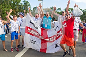 Football fans of England with the national flag glorify their team in the World Cup before the match England Sweden