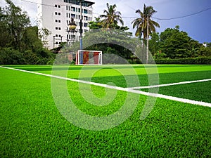 Football field, astro turf surface. Close up of throw in, kick off and corner area. Lushed green football pitch