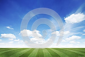 Football field with cloud sky background.