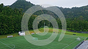 Football field green forest nature. Sport lawn playground in national woodland