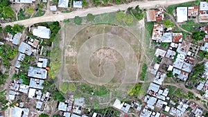 Football field among houses in zanzibar, aerial, topview