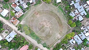 Football field among houses in zanzibar, aerial, topview