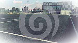 football field with markings. Football stadium. Sports background. Sports center in the city. Vintage or retro style