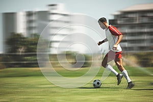 Football, fitness and soccer player running on the field to score goals in a sports match or training game outdoors